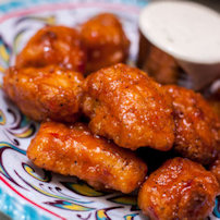 Wings with Ranch Dressing on side